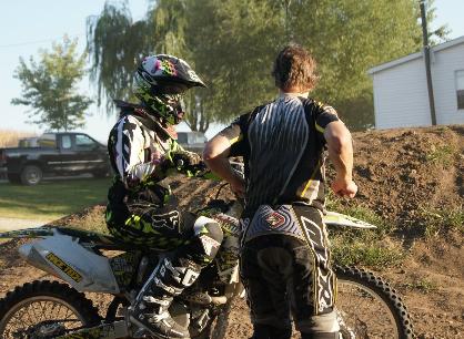 Instructor Steve Wagner demonstrates a trick to rider Chuck Lucas.
